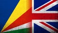 National flag of United Kingdom Great Britain Union Jack with The Republic of Seychelles National flag. Grunge background