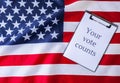 The National Flag of the United states of America. American Flag with paper note message text. Election day, give vote Royalty Free Stock Photo