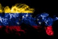 National flag of Venezuela made from colored smoke isolated on black background. Abstract silky wave background. Royalty Free Stock Photo