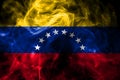 National flag of Venezuela made from colored smoke isolated on black background. Abstract silky wave background. Royalty Free Stock Photo