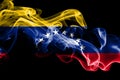 National flag of Venezuela made from colored smoke isolated on black background. Abstract silky wave background Royalty Free Stock Photo