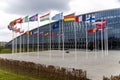 The national flags of countries member of the NATO fly outside the organisation headquarters in Brussels, Belgium on April 20 2023 Royalty Free Stock Photo