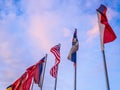 National flags of different countries on the sky background.