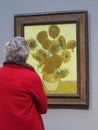 National Gallery, London. A red coat lady watching Vincent van Gogh. Royalty Free Stock Photo