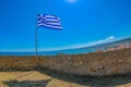 National Greek flag fluttering from the Venetian Fortezza Castle, Rethymno, Crete, Greece Royalty Free Stock Photo
