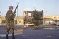 National Guardsman patrolling in front of burned business after 1992 riots, South Central Los Angeles, California
