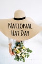 National Hat Day 15 January greeting card banner with hipster woman and many straw hats. Stylish young woman and text