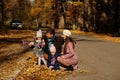 National holiday of United Kingdom. Family with british flags in autumn park. Britishness celebrating UK. Two kids