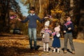 National holiday of United Kingdom. Four kids with british flags in autumn park. Britishness celebrating UK