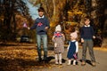 National holiday of United Kingdom. Four kids with british flags in autumn park. Britishness celebrating UK