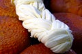 National homemade Circassian cheese, on the table, close-up. White cheese pigtail Royalty Free Stock Photo