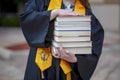 National Honor Society Graduate with Stack of Books