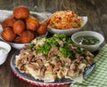National Kazakh dishes: Beshbarmak, salad of radish Shalgam, and Baursak. Royalty Free Stock Photo
