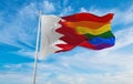 national lgbt flag of Bahrain flag waving in the wind at cloudy sky. Freedom and love concept. Pride month. activism, community