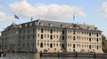 National Maritime Museum of Amsterdam and a tourist wooden boat