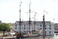 National Maritime Museum of Amsterdam and a tourist wooden boat