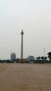 The National Monument, known as Monas, seen from a distance, is in Central Jakarta, Indonesia Royalty Free Stock Photo