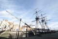 HMS Trincomalee Tall Ship wide angle photo with buildings on sunny day