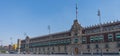 National Palace in Zocalo square Mexico city. Architecture, travel photo. View with blue sky. Background