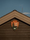 National Park Logo On The Gable End Of Entrance Station Roof