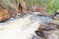 river and red wall of canyon Kiutakongas rapids in Oulanka National Park, edge of the forest Royalty Free Stock Photo