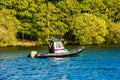 National Park Ranger in boat on Windermere Lake District UK
