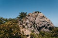 National Park, tourist camping place. Beautiful stone rock mountain close-up. Green vegetation on a rocky mountain rock Royalty Free Stock Photo