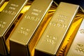 National reserve of gold, financial stability and commodity trading concept with many pure solid gold bars in a raw on black Royalty Free Stock Photo