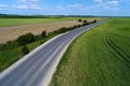 National road seen from drone, green fields around