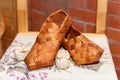 National Russian bast shoes on brick background