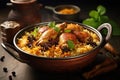 The national Saudi Arabian dish chicken kabsa with rice mandi on wooden table