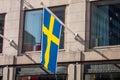 National Swedish flag on a building in Stockholm Royalty Free Stock Photo