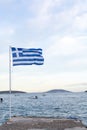 National symbol of Greece, blue-white greek flag, sea water and blue sky, copy space Royalty Free Stock Photo