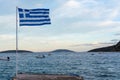 National symbol of Greece, blue-white greek flag, sea water and blue sky, copy space Royalty Free Stock Photo