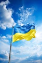 national Ukrainian blue and yellow flag on blue sky background Royalty Free Stock Photo