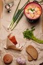 National Ukrainian cuisine. Lard in paprika, borscht with sour cream, rye bread, greenery and vodka bottle. Cottage meal Royalty Free Stock Photo