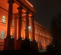 National university red building illuminated on autumn night