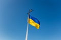 National Yellow-blue Ukrainian flag against the blue sky on mound of Union of Lublin at Castle Hill in Lviv city, Ukraine Royalty Free Stock Photo