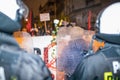 Nationalists, hooligans and fascists awaiting the Parliament Member Winnicki. On the other side of street people protesting agains Royalty Free Stock Photo