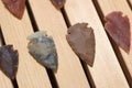 Native American Arrowhead Collection on Wooden Background Royalty Free Stock Photo