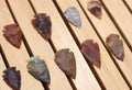 Native American Arrowhead Collection on Wooden Background Royalty Free Stock Photo