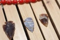 Native American Arrowhead Collection on Wooden Background Royalty Free Stock Photo