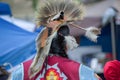 Native American head dress and clothing a Pow Wow