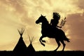 Native American Indian On Horseback At Sunset