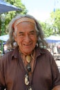 Native American Indian Man with handcrafted Amulets Carved from Soapstone.