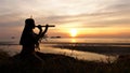 A Native American Indian plays music on a bamboo flute.