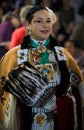 Native American Indian woman dressed in intricate and colorful traditional outfit dancing at powwow, San Francisco, USA Royalty Free Stock Photo