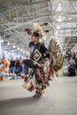 Native American Indians dressed in intricate and colorful traditional outfits dancing at a powwow in San Francisco, USA Royalty Free Stock Photo