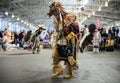 Native American Indians dressed in intricate and colorful traditional outfits dancing at a powwow in San Francisco, USA Royalty Free Stock Photo