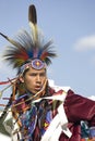 Native American man in full dress.